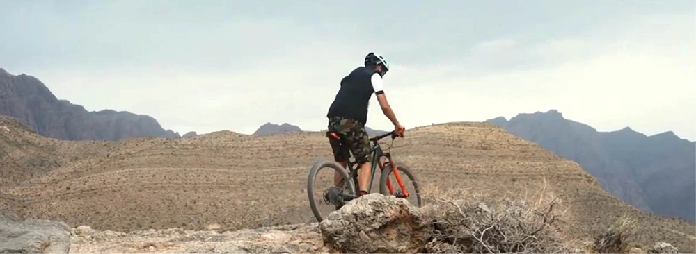 heart attack patient Joe on a bike riding in a desert