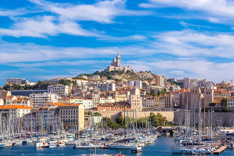 Aerial panoramic view on basilica of Notre Dame de la Garde and old port in Marseille, France