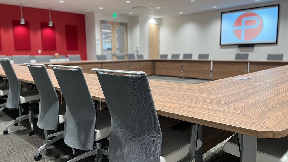 Penumbra Boardroom with chairs, table, and Penumbra P on projector