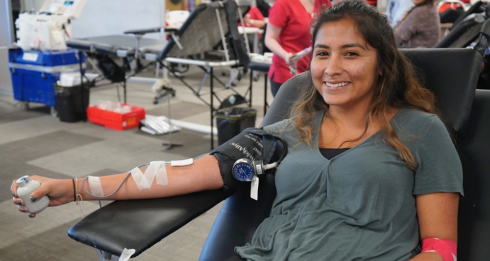 Christina a Penumbra Employee Giving Blood at a blood drive